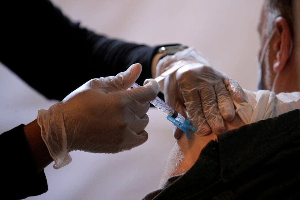  More than half of American adults vaccinated as COVID-19 cases ebb